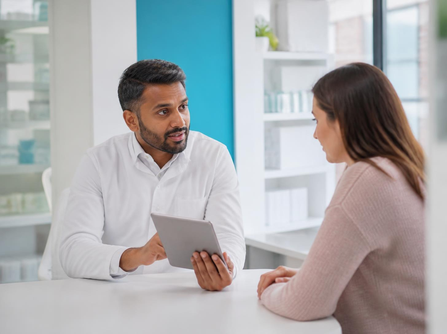 Pharmacist discussing symptoms with a patient